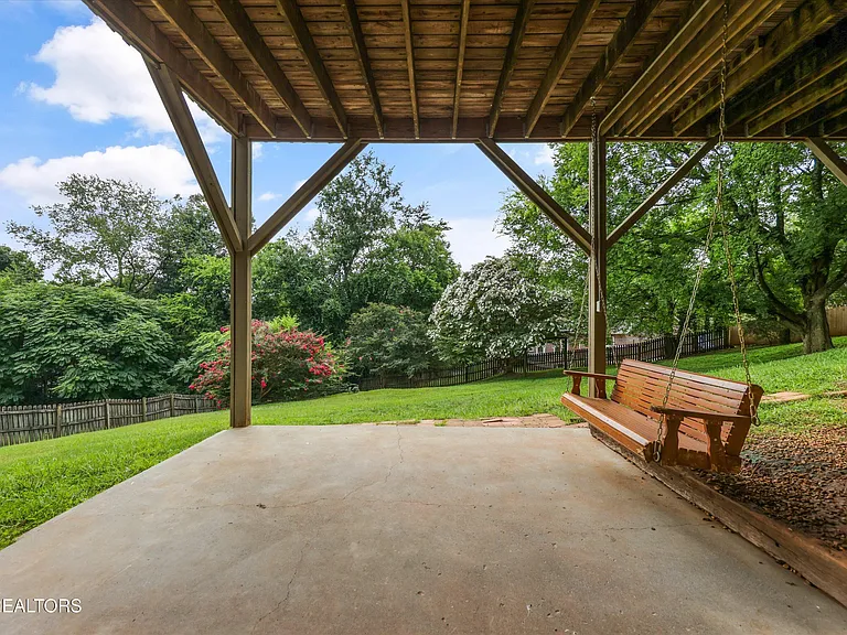 Covered patio and porch swing at 11016 Calloway View Dr